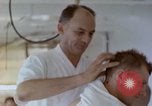 Image of wounded Marines Pacific Ocean, 1945, second 44 stock footage video 65675077542