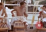 Image of wounded Marines Pacific Ocean, 1945, second 48 stock footage video 65675077542