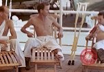 Image of wounded Marines Pacific Ocean, 1945, second 49 stock footage video 65675077542