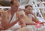 Image of wounded Marines Pacific Ocean, 1945, second 51 stock footage video 65675077542