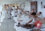 Image of wounded Marines Pacific Ocean, 1945, second 60 stock footage video 65675077542