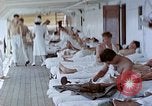 Image of wounded Marines Pacific Ocean, 1945, second 62 stock footage video 65675077542