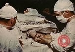 Image part le traitement des plaies Seconde Guerre Mondiale United States USA, 1945, de la seconde 14 séquences d'archives historiques vidéo 65675077550