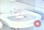 Image of bird in bathroom Berchtesgaden Germany, 1940, second 1 stock footage video 65675077773