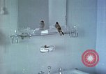Image of bird in bathroom Berchtesgaden Germany, 1940, second 7 stock footage video 65675077773