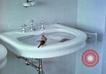Image of bird in bathroom Berchtesgaden Germany, 1940, second 14 stock footage video 65675077773