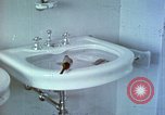 Image of bird in bathroom Berchtesgaden Germany, 1940, second 15 stock footage video 65675077773