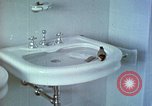 Image of bird in bathroom Berchtesgaden Germany, 1940, second 16 stock footage video 65675077773