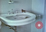 Image of bird in bathroom Berchtesgaden Germany, 1940, second 19 stock footage video 65675077773