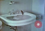 Image of bird in bathroom Berchtesgaden Germany, 1940, second 49 stock footage video 65675077773
