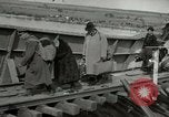 Image of German civilians cross severely damaged bridge over Elbe River Tangermunde Germany, 1945, second 31 stock footage video 65675077887