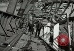 Image of German civilians cross severely damaged bridge over Elbe River Tangermunde Germany, 1945, second 38 stock footage video 65675077887