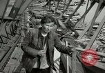Image of German civilians cross severely damaged bridge over Elbe River Tangermunde Germany, 1945, second 46 stock footage video 65675077887