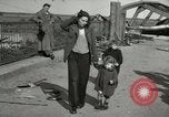 Image of German civilians cross severely damaged bridge over Elbe River Tangermunde Germany, 1945, second 57 stock footage video 65675077887