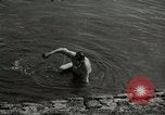 Image of German soldiers on American side of Elbe River at end of World War 2 Tangermunde Germany, 1945, second 32 stock footage video 65675077888
