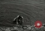 Image of German soldiers on American side of Elbe River at end of World War 2 Tangermunde Germany, 1945, second 33 stock footage video 65675077888