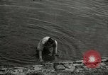 Image of German soldiers on American side of Elbe River at end of World War 2 Tangermunde Germany, 1945, second 34 stock footage video 65675077888