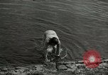 Image of German soldiers on American side of Elbe River at end of World War 2 Tangermunde Germany, 1945, second 35 stock footage video 65675077888
