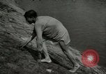 Image of German soldiers on American side of Elbe River at end of World War 2 Tangermunde Germany, 1945, second 37 stock footage video 65675077888