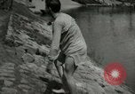 Image of German soldiers on American side of Elbe River at end of World War 2 Tangermunde Germany, 1945, second 38 stock footage video 65675077888