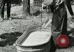 Image of worker washes a dog on Circus camp ground United States USA, 1919, second 7 stock footage video 65675078135