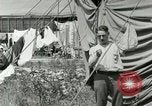 Image of worker washes a dog on Circus camp ground United States USA, 1919, second 34 stock footage video 65675078135
