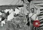 Image of worker washes a dog on Circus camp ground United States USA, 1919, second 36 stock footage video 65675078135