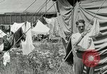 Image of worker washes a dog on Circus camp ground United States USA, 1919, second 37 stock footage video 65675078135