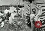 Image of worker washes a dog on Circus camp ground United States USA, 1919, second 39 stock footage video 65675078135