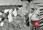 Image of worker washes a dog on Circus camp ground United States USA, 1919, second 41 stock footage video 65675078135