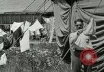 Image of worker washes a dog on Circus camp ground United States USA, 1919, second 42 stock footage video 65675078135