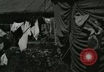 Image of worker washes a dog on Circus camp ground United States USA, 1919, second 44 stock footage video 65675078135