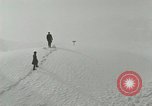 Image of Men walk carefully on frozen Niagara River New York United States USA, 1919, second 5 stock footage video 65675078137