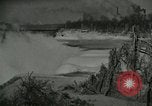 Image of Men walk carefully on frozen Niagara River New York United States USA, 1919, second 10 stock footage video 65675078137