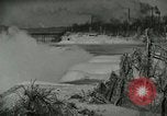 Image of Men walk carefully on frozen Niagara River New York United States USA, 1919, second 14 stock footage video 65675078137