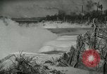 Image of Men walk carefully on frozen Niagara River New York United States USA, 1919, second 17 stock footage video 65675078137