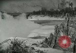 Image of Men walk carefully on frozen Niagara River New York United States USA, 1919, second 18 stock footage video 65675078137