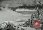 Image of Men walk carefully on frozen Niagara River New York United States USA, 1919, second 20 stock footage video 65675078137