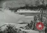 Image of Men walk carefully on frozen Niagara River New York United States USA, 1919, second 21 stock footage video 65675078137