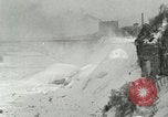 Image of Men walk carefully on frozen Niagara River New York United States USA, 1919, second 26 stock footage video 65675078137