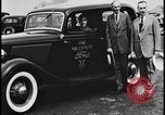 Image of Henry Ford with 1930's Ford sedans Dearborn Michigan USA, 1935, second 15 stock footage video 65675078249