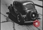 Image of Henry Ford with 1930's Ford sedans Dearborn Michigan USA, 1935, second 30 stock footage video 65675078249