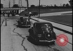 Image of Henry Ford with 1930's Ford sedans Dearborn Michigan USA, 1935, second 33 stock footage video 65675078249