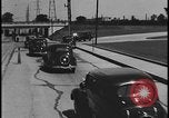 Image of Henry Ford with 1930's Ford sedans Dearborn Michigan USA, 1935, second 36 stock footage video 65675078249