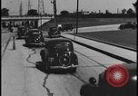 Image of Henry Ford with 1930's Ford sedans Dearborn Michigan USA, 1935, second 37 stock footage video 65675078249