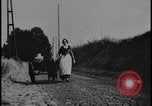Image of Dutch woman with milk cart pulled by dog Dearborn Michigan USA, 1935, second 30 stock footage video 65675078255