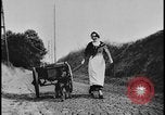 Image of Dutch woman with milk cart pulled by dog Dearborn Michigan USA, 1935, second 32 stock footage video 65675078255