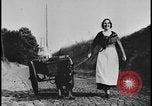 Image of Dutch woman with milk cart pulled by dog Dearborn Michigan USA, 1935, second 33 stock footage video 65675078255