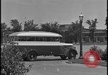 Image of Young men and women punch  time clock at Ford facility Dearborn Michigan  USA, 1938, second 3 stock footage video 65675078259