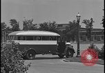 Image of Young men and women punch  time clock at Ford facility Dearborn Michigan  USA, 1938, second 7 stock footage video 65675078259